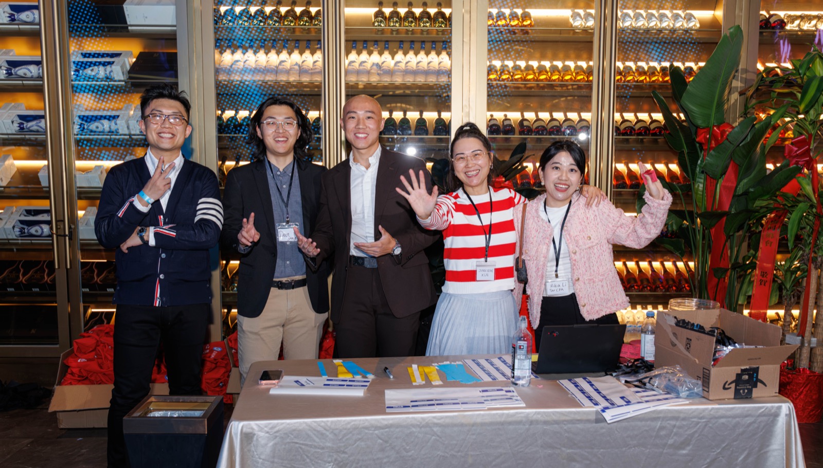 Director Claire Jingjing Xue (second from right) and the check-in team welcome guests