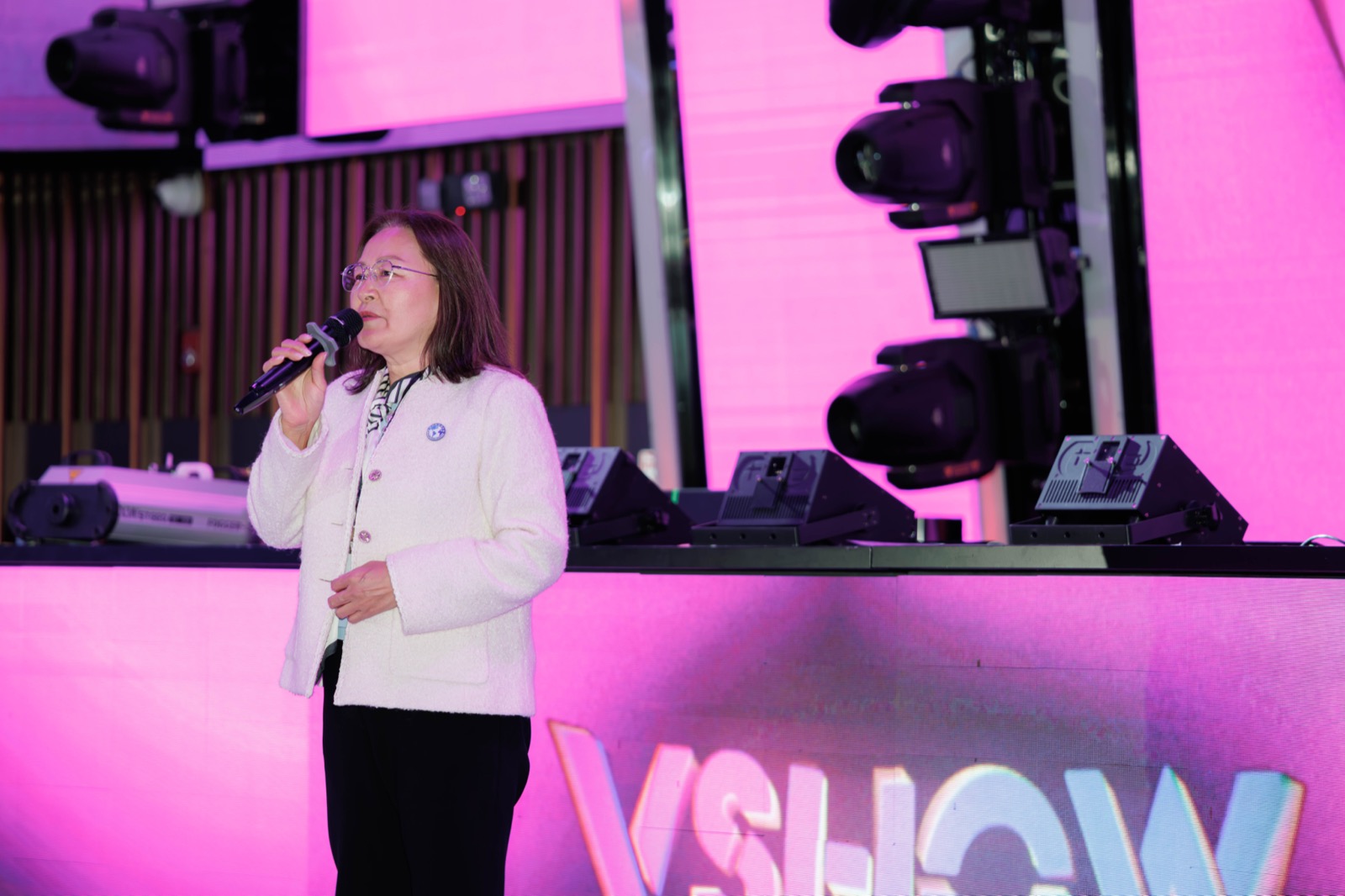 A guest delivers remarks on stage