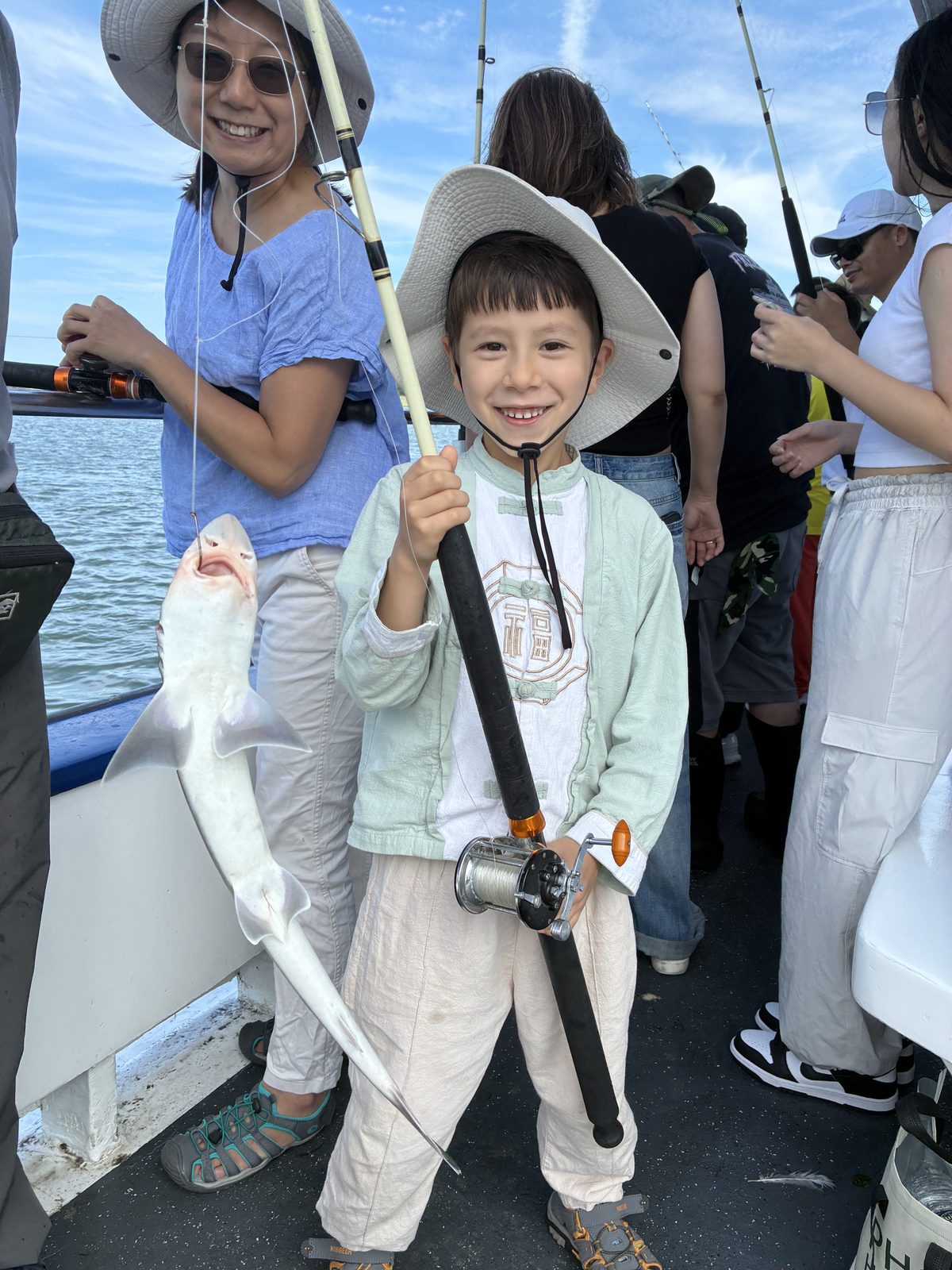 A mom and her little one enjoy a day out at sea