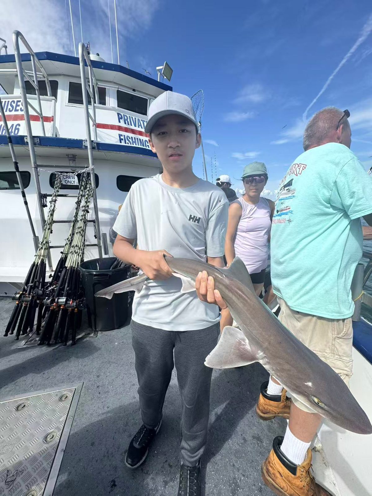 An angler shows off a big catch of the day