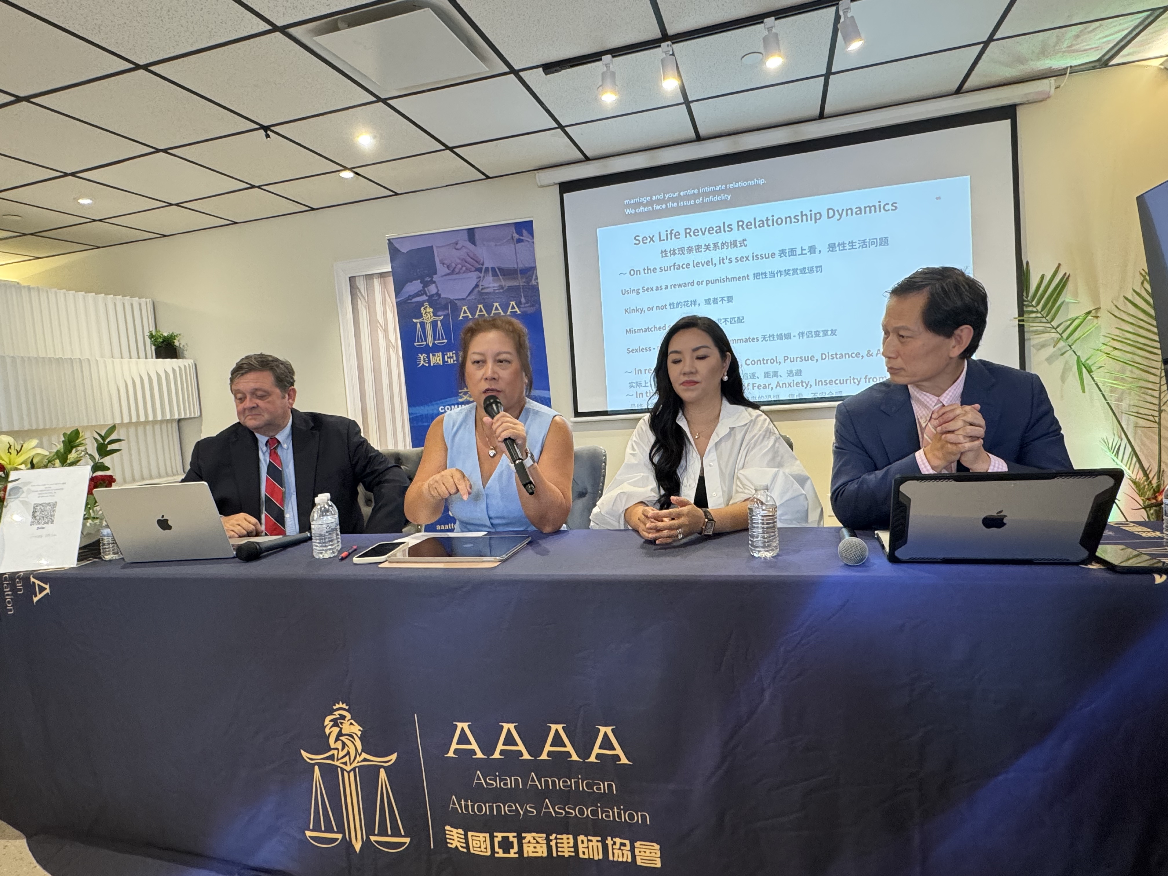 The moderator and three guest speakers on the panel